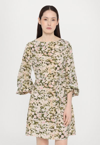 Floral print dress in light beige with green and pink accents, featuring long sleeves, a boat neckline, and a cinched waist with a tie.