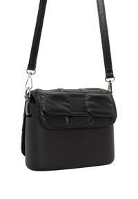 Black crossbody bag with a textured flap, smooth body, and adjustable strap. Features silver hardware and a minimalist design.