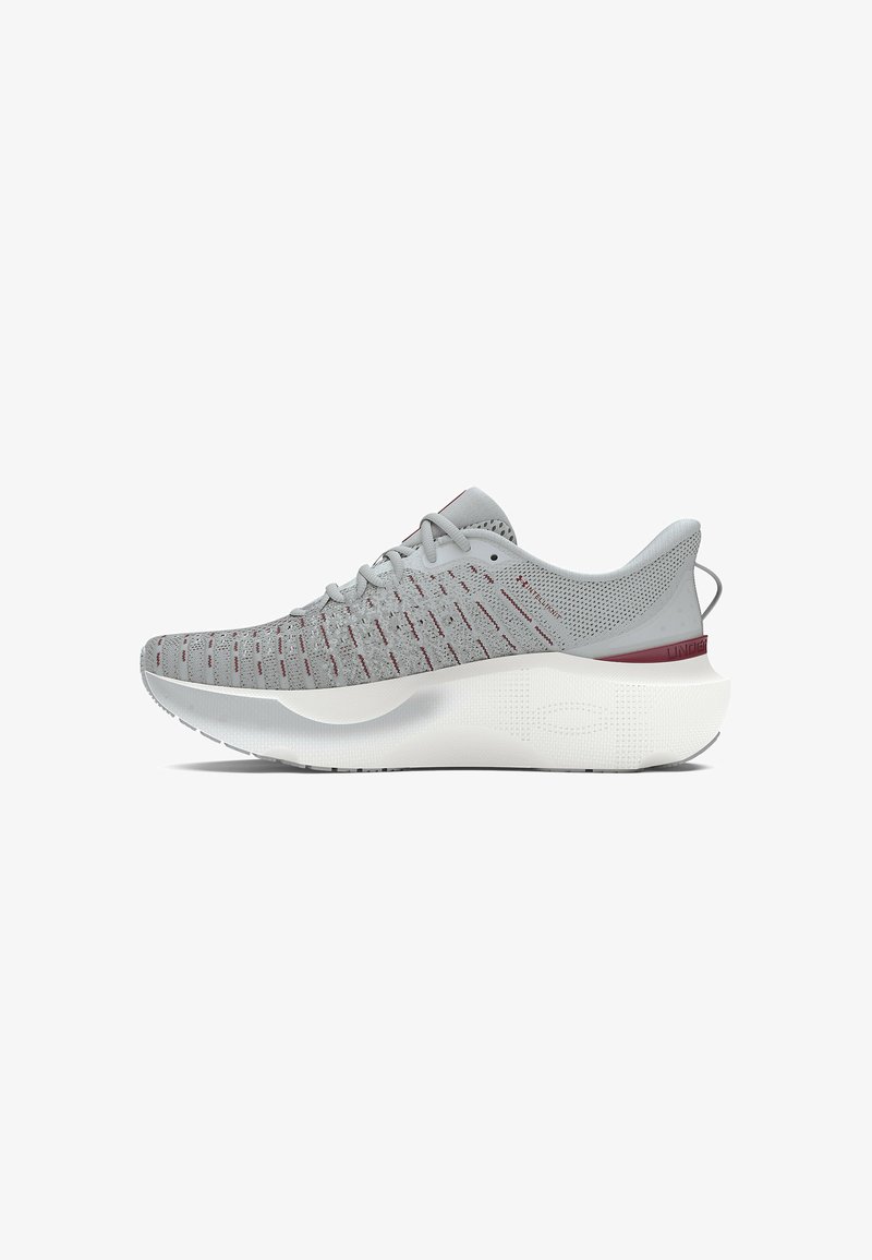 Gray running shoe with a mesh upper featuring red accents, a thick white sole, and a textured design for grip.