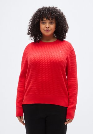 Piros kötött pulóver texturált gyémántmintával, kerek nyakkivágással és hosszú ujjakkal. Kis logóval a mellrészen.