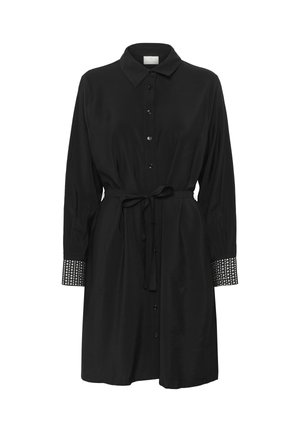 Schwarzes Hemdkleid aus glattem Stoff. Verfügt über einen Taillengürtel und strukturierte Manschetten, die mit kleinen Nieten verziert sind. Langärmliges Design.