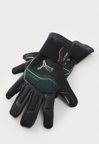 Svarta sporthandskar med gröna detaljer, som har ett texturerat grepp, en snug passform, justerbart handledsband och förstärkta fingertoppar.
