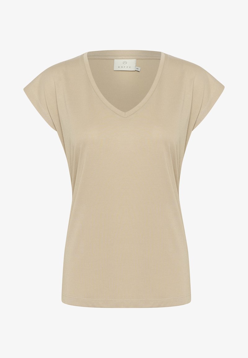 T-shirt beige à col en V avec des manches courtes et épaules recouvrantes, de coupe décontractée. Fabriqué en tissu léger et lisse avec des détails de couture minimalistes.