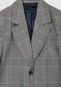Blazer a quadri grigi con design doppiopetto, linee rosa a contrasto, revers a punta e taschino sul petto con motivo houndstooth.