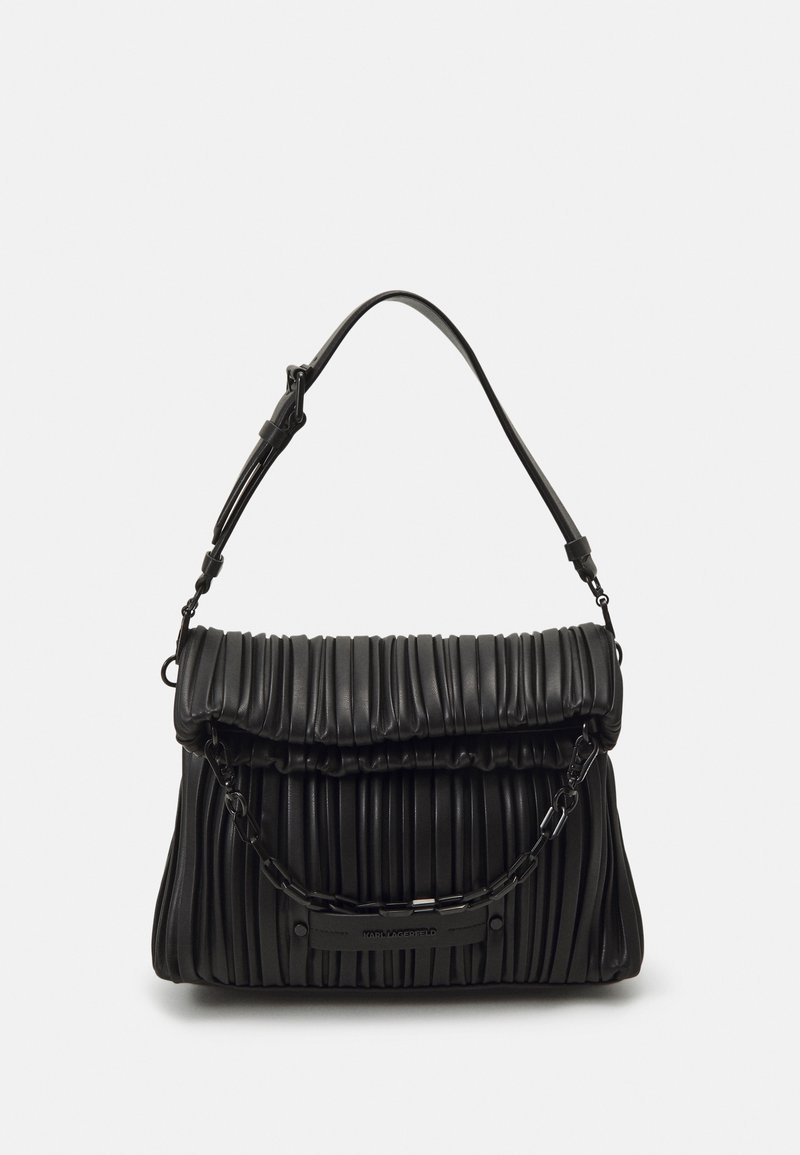 Black leather handbag featuring a pleated design, a chain accent, and a curved top flap. Adjustable strap for versatile carrying options.