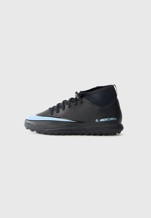Black synthetic soccer shoes with a low ankle design, featuring a blue accent stripe and textured rubber sole for traction.