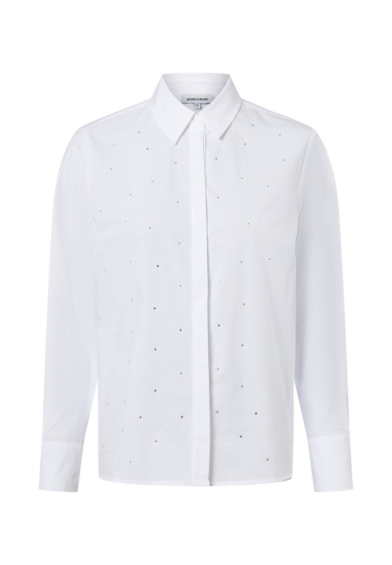 White long-sleeve shirt with a button-down collar, featuring a pattern of small, silver embellishments across the front. Smooth fabric texture.