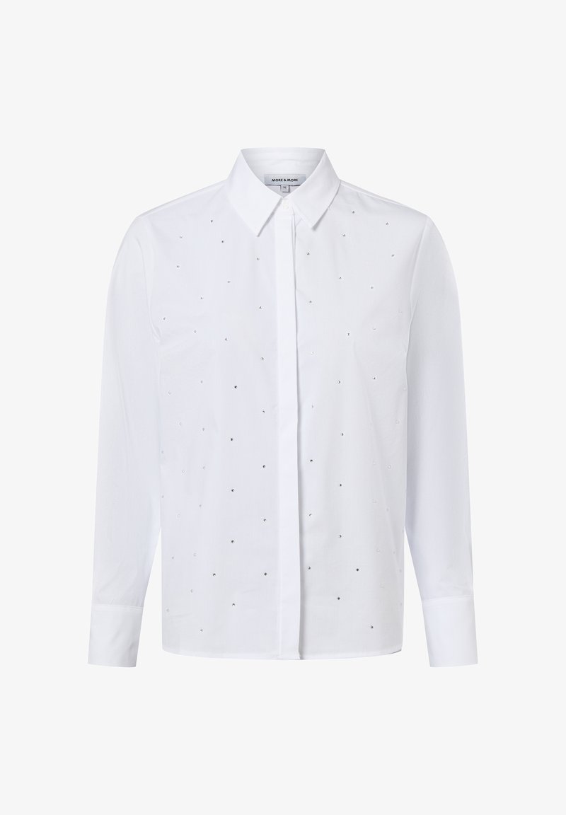 White long-sleeve shirt with a button-down collar, featuring a pattern of small, silver embellishments across the front. Smooth fabric texture.