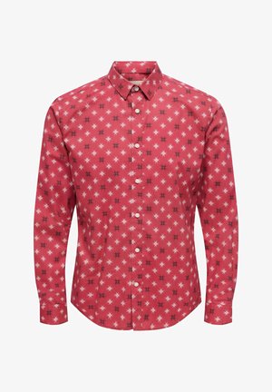 Red long-sleeve button-up shirt with white and black starburst pattern and a pointed collar.