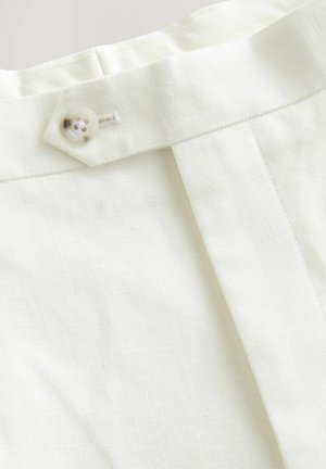 White fabric with a smooth texture featuring a single button closure, a pleated design, and neat stitching details.