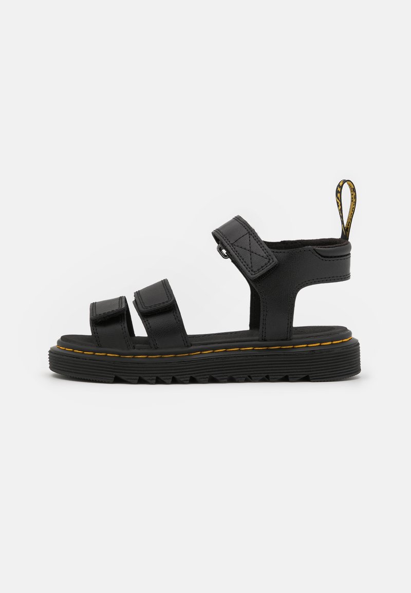 Black leather sandals featuring three adjustable straps, a textured sole, and yellow stitching along the edge. Back pull tab for easy wear.
