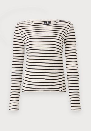 Maglia a maniche lunghe a righe in crema e nero. Presenta una texture a coste e un collo rotondo. Orlo dritto con lievi spacchi laterali.