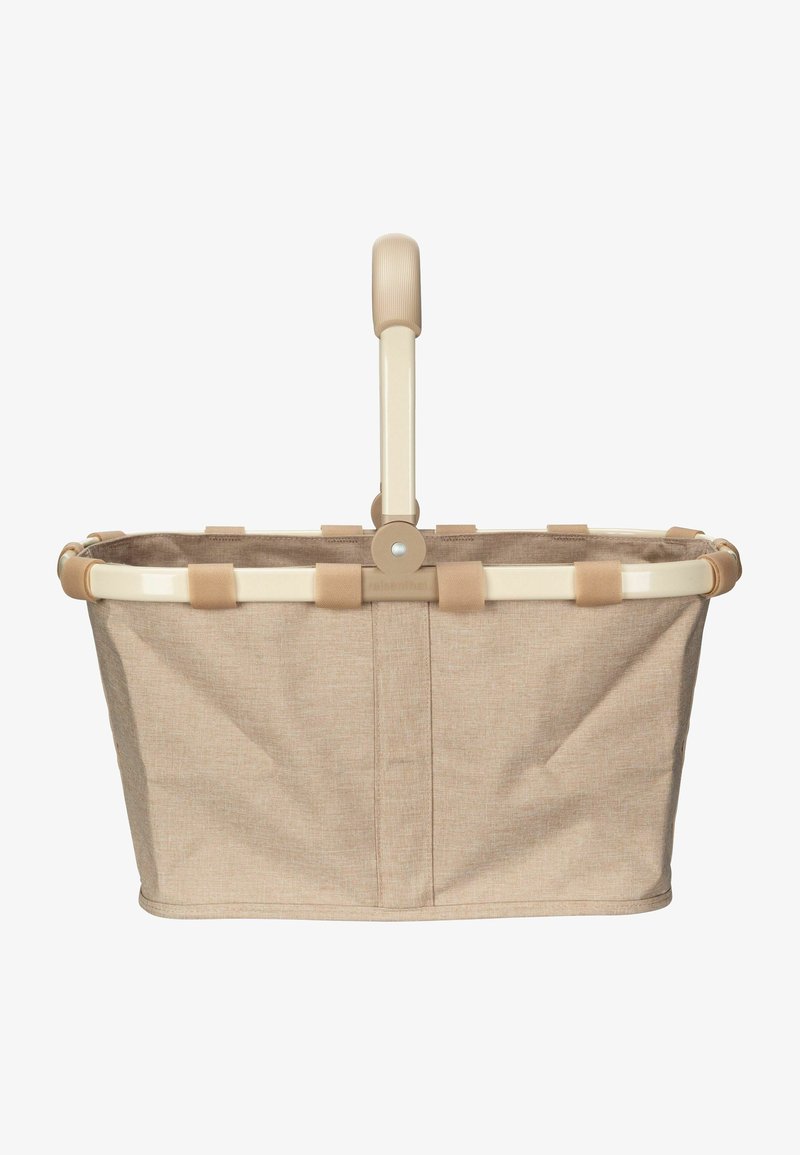 Beige Stoffeinkaufsnetz mit einem cremefarbenen Metallrahmen und einem strukturierten Griff. Ausgestattet mit Stoffriemen, die den Korb am Rahmen sichern.