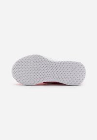White rubber shoe sole with textured zigzag pattern; features "RUNNING" label on side. Smooth, rounded shape, no visible markings or colors.
