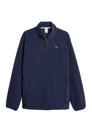 Pullover in pile blu navy con colletto alto, mezza zip e accento con logo. Presenta maniche lunghe con polsini elasticizzati e una texture morbida.