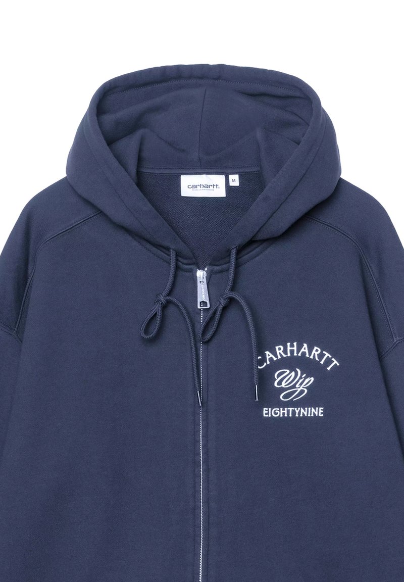 Sudadera con capucha con cremallera Carhartt azul marino con capucha con cordón y texto blanco "Carhartt Wip Eightynine" en el pecho izquierdo.