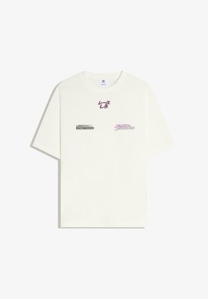 White short-sleeve t-shirt with black and pink text reading "Legacy Street Racing," "Fast & Furious," and Japanese characters in the center.