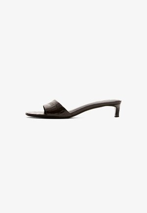 Women's dark brown low-heeled mule sandal with a single wide front strap and a square toe on a white background.