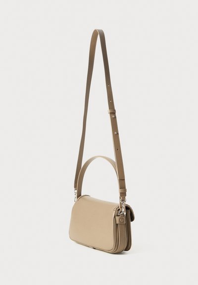 Beige leather shoulder bag with a long adjustable strap, rectangular shape, flat design, and silver hardware accents.