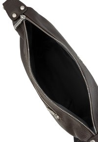 Brown leather sling bag with a textured exterior, silver zipper, and black fabric lining. Features a single strap and an interior pocket.