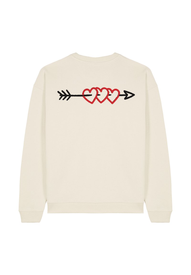 Felpa color crema con un design ricamato di tre cuori rosse collegate da una freccia nera sul retro.