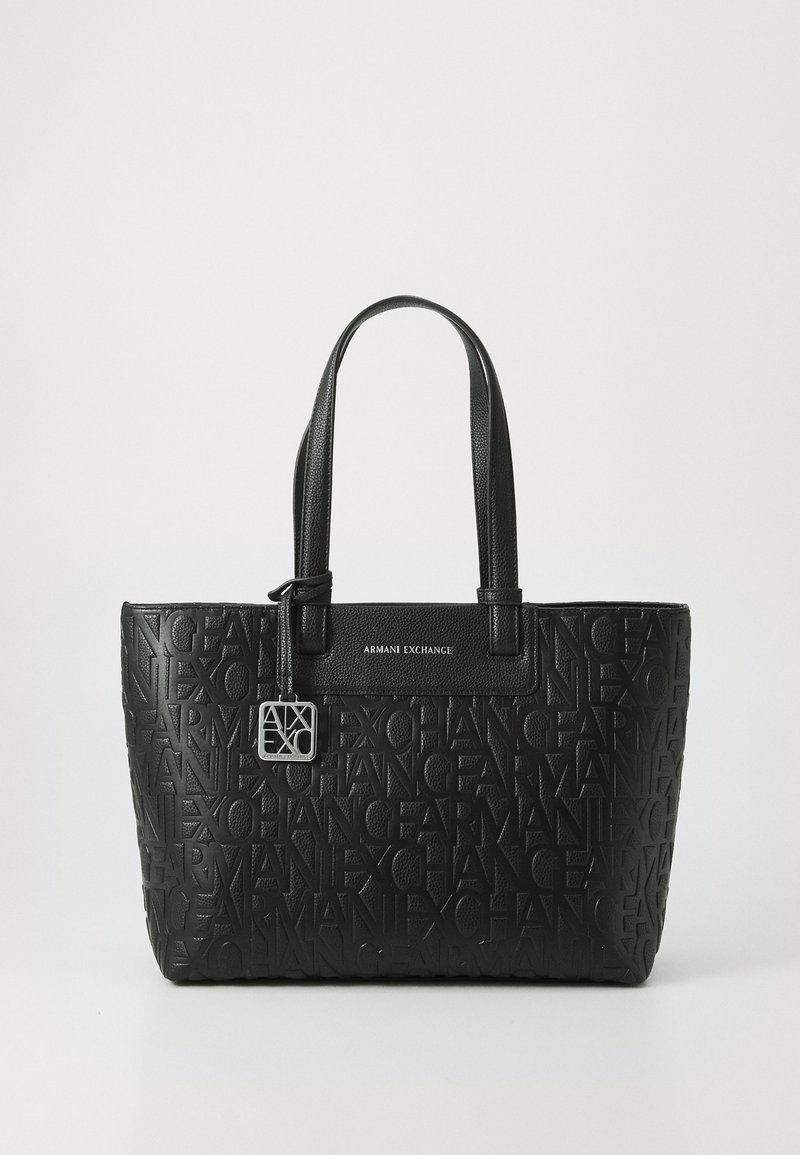 Black tote bag made of textured faux leather, featuring embossed logo patterns, flat shoulder straps, and a silver hardware accent.