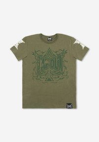 Olive green cotton T-shirt featuring a large dark green "TAPOUT" graphic and ornate designs on the front and white logo accents on the sleeves.