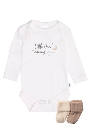White long-sleeve baby onesie with "Little One coming soon" text, a crescent moon, stars, and beige and brown baby socks.