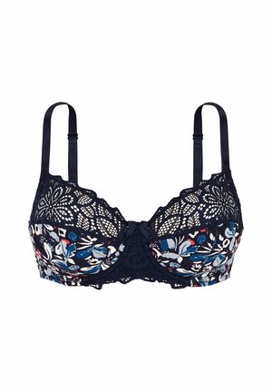Soutien-gorge en dentelle florale marine avec des détails complexes, des bretelles réglables et un nœud décoratif au centre. Il présente un design doux et texturé.