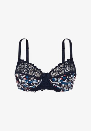 Soutien-gorge en dentelle florale marine avec des détails complexes, des bretelles réglables et un nœud décoratif au centre. Il présente un design doux et texturé.