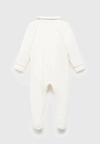 Pitkähihaiset vauvan haalari pehmeästä kermavärisestä kankaasta, jossa on kaulus, hihansuissa vaaleanpunaiset yksityiskohdat ja jalkapohjat mukavuutta varten.