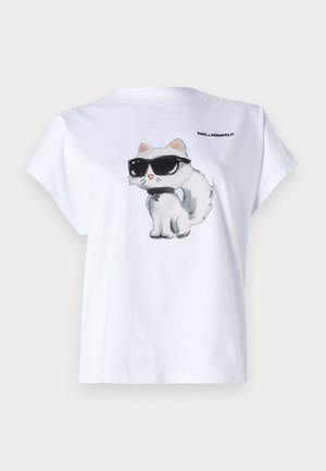 Bijela pamučna majica s kratkim rukavima koja prikazuje crtanog mačka u sunčanim naočalama, s opuštenim krojem. Na leđima se nalazi logo "KARL LAGERFELD".