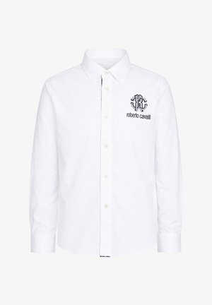 Camisa blanca de manga larga con botones, cuello puntiagudo y logo negro "roberto cavalli" en el pecho izquierdo.
