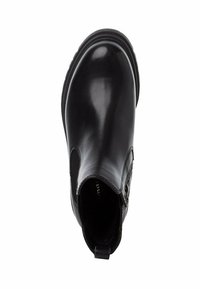 Black leather Chelsea boot with elastic side panels, rounded toe, and textured sole. Features pull tab at the heel for easy wear.