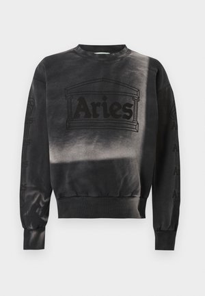 Black crewneck sweatshirt with "Aries" text and architectural column design on front, ribbed cuffs and hem, and subtle sleeve graphics.