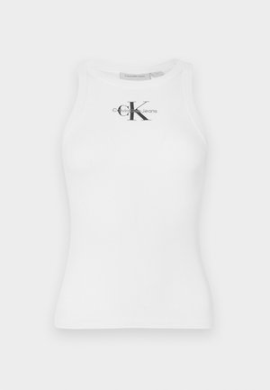 Top de tirantes de algodón blanco con textura acanalada y escote redondo, que presenta un logo negro "CK" en el centro y texto de la marca debajo.