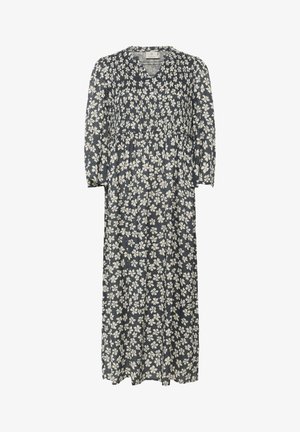 Robe maxi florale en bleu marine avec des fleurs blanches. Décolleté en V, corsage froncé élastique, manches trois-quarts, tissu léger et doux.