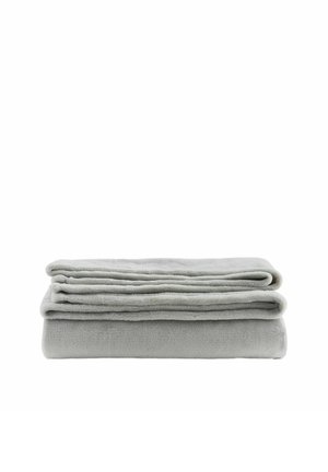 Soft light gray fleece blanket neatly folded with smooth texture against a white background.