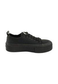 Mustad mustad sneakers paksu, sooniku tald. Omab paeltega esiosa ja tõmblukku kand. Minimalistlik disain, ilma mustrite või aktsentideta.