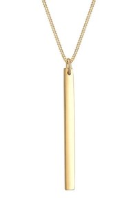 Auksinis pakabukas ant ilgo stačiakampio užrašo su plonu grandinėle. Lygus paviršius su poliruotu blizgesiu.