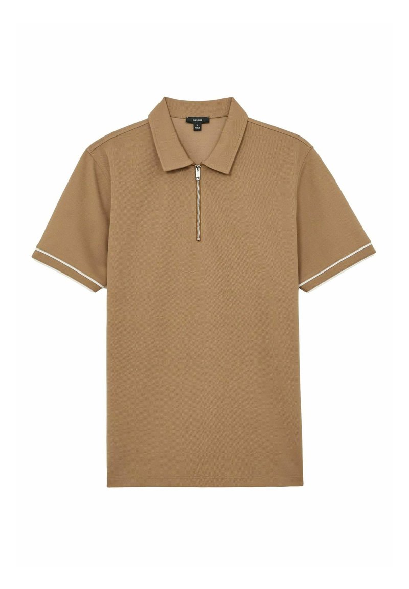 Kortærmet polo-shirt i tan stof med lynlås. Har kontrastfarvet hvid kant på ærmerne og har et klassisk kravedesign.