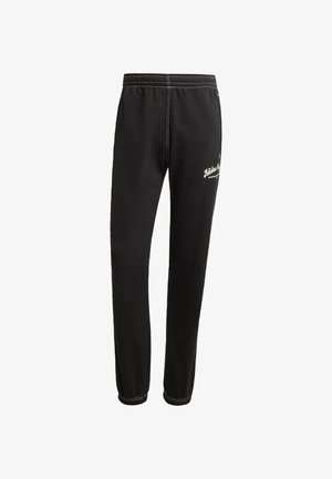 Mustad mustad püksid, millel on elastne vöökoht, kontrastne valge õmblus ja logo detail reiel. Valmistatud pehmest kangast.