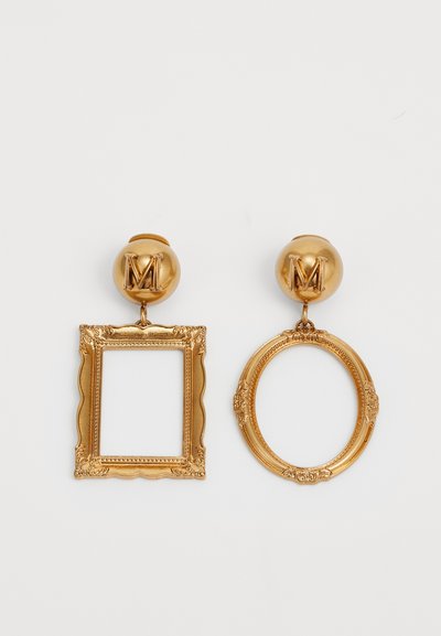 Gold-tone earrings featuring a decorative frame pendant and a circular pendant. Both have intricate detailing and embossed "M" initials.