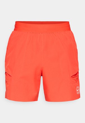 Spēcīgi oranži sporta šorti ar elastīgu jostu, sānu krokām un divām slīpām sānu kabatām. Gluda, viegla auduma.