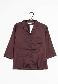 Camicia button-up bordeaux con colletto, maniche a tre quarti e una tasca sul petto; realizzata in un tessuto liscio con una leggera lucentezza.