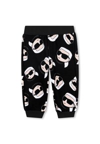 Pantaloni della tuta neri con facce di cartoni animati stampate che indossano occhiali da sole; presentano una cintura elastica e polsini, realizzati in un tessuto morbido.