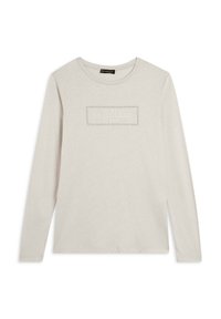 Maglietta a maniche lunghe di un tenue color crema con un logo rettangolare testurizzato sulla parte anteriore. Realizzata in cotone morbido con una vestibilità rilassata.