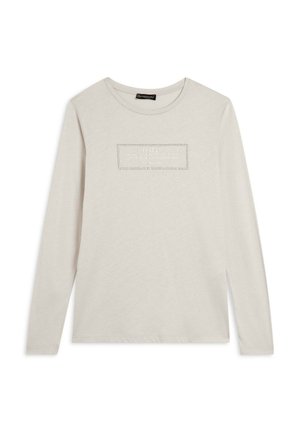 Maglietta a maniche lunghe di un tenue color crema con un logo rettangolare testurizzato sulla parte anteriore. Realizzata in cotone morbido con una vestibilità rilassata.