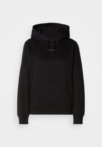 Sweat à capuche noir avec poche avant et petit logo blanc Tommy Jeans centré sur la poitrine, présenté sur fond blanc.