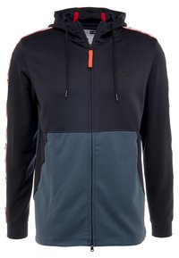 Sort og grå zip-up hoodie med hætte, med kontrastfarvede sidelister, justerbare snore, og en frontlynlås.